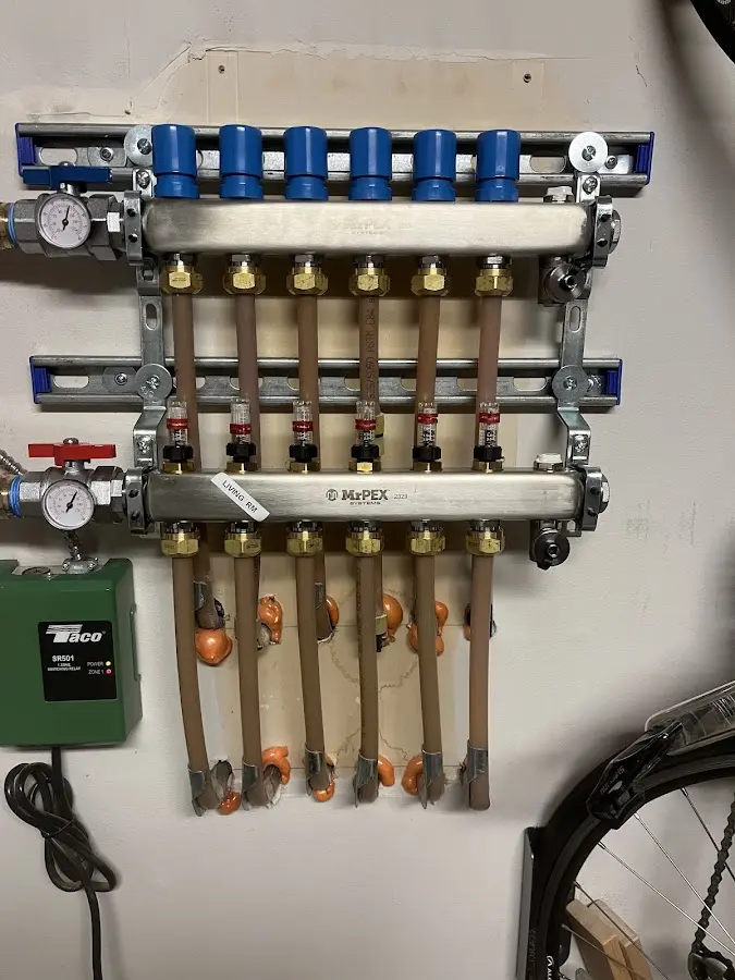 Plumber performing Gas Line Installation at a residential property in Newton